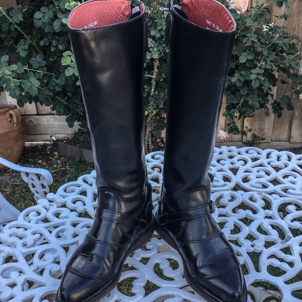 Dr. Marten’s Knee-high Buckle and zipper Boots.